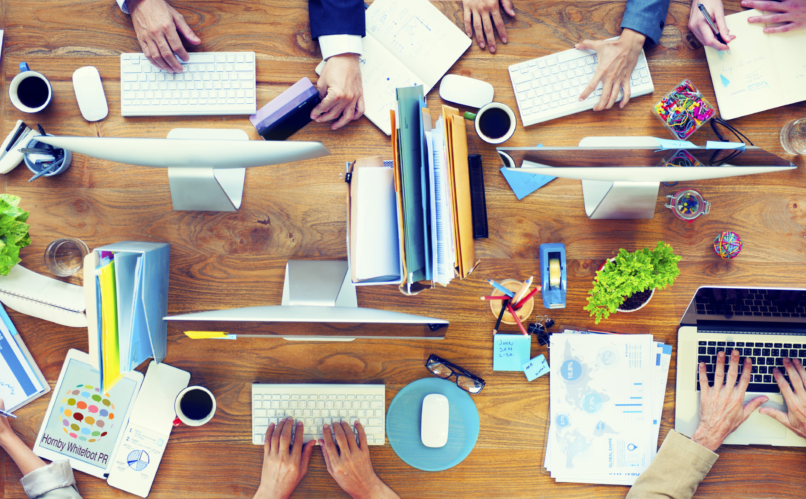 Group of Business People Working on an Office Desk