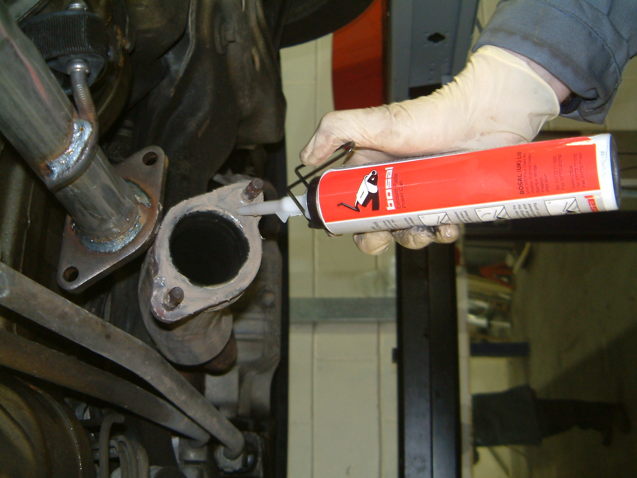 mechanic-applying-exhaust-paste